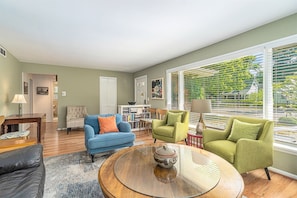 Bright and welcoming living room with plenty of comfortable furniture to relax