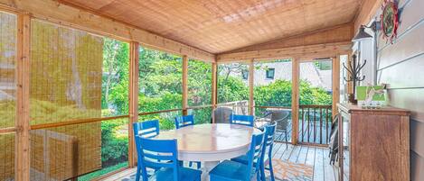 The spacious screen porch has outdoor dining for everyone to enjoy a meal in the fresh air