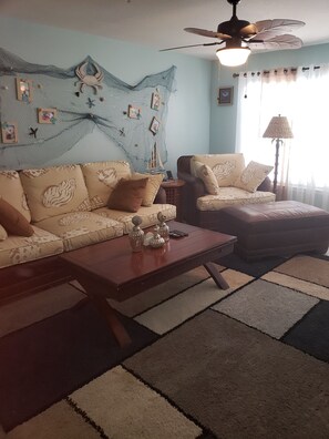 Living Room offers full size sofa ,
 Chair and ottoman cozy reading area. 