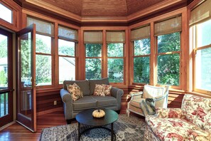 Back 3 season porch off the kitchen--perfect for lounging.