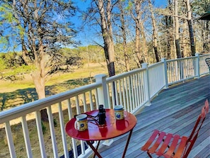 Enjoy your morning cup of coffee and watch the birds fly over the conservation land outside the sliding glass door - 85 Cockle Drive South Chatham Cape Cod - Ides of Marsh - New England Vacation Rentals