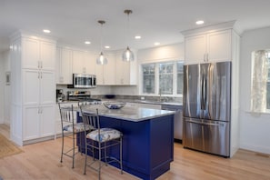 Stainless steel and hues of blue adorn this kitchen - 85 Cockle Drive South Chatham Cape Cod - Ides of Marsh - New England Vacation Rentals