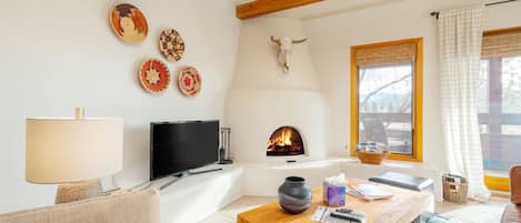 Cozy Living room with a kiva electric fireplace!