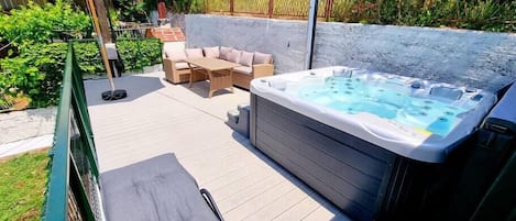 Jacuzzi and outdoor furniture with shower