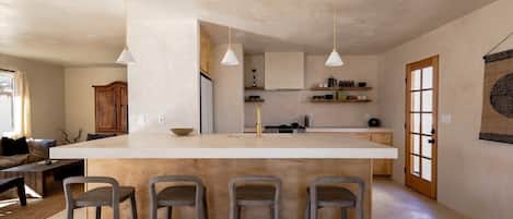 In a wabi-sabi kitchen, natural materials such as wood, stone, and clay predominate, and the overall look is understated, unpretentious, and characterized by patina and texture. 