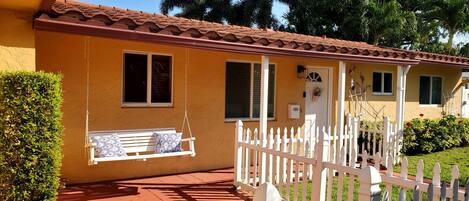 Enjoy the front porch swing on a beautiful Florida day.