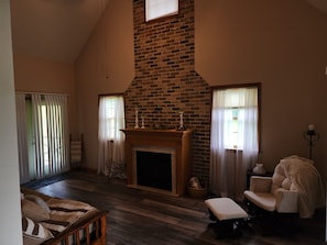 Living room, sleeper sofa, TV, ceiling fan