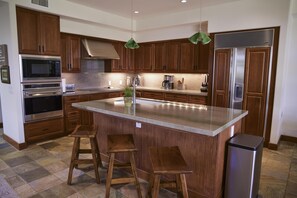 Spacious Kitchen with Sub Zero refrigerator and Wolf ovens and cooktop.