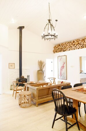 The living room with wood burning fireplace 