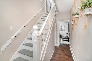 When guests enter the front door, they will find a shared foyer. The upstairs unit is to the left (sleeps up to four people); the main floor unit is to the right (sleeps up to six people).