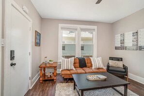 Downstairs unit living area. Note: The futon has been replaced with a more comfortable/larger, queen sleeper sofa (sleeps up to 2).