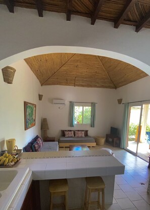 View from the open kitchen into the bright living room 