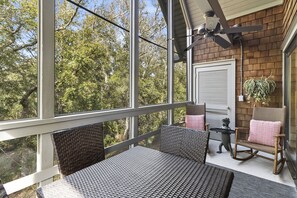 Enjoy the coastal breeze on the screened porch.