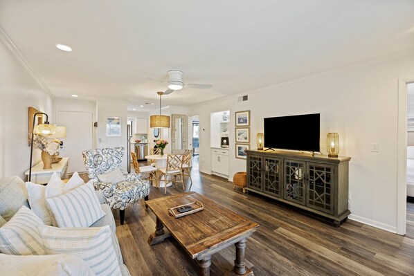 Large living room space with screened porch directly to the right.  Plenty of room for the whole family