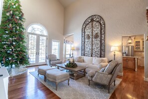 Vaulted great room with antique Spanish gate.