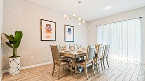 Host memorable meals in this beautifully designed dining room, featuring contemporary decor and ample seating for the whole family.