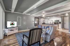 Living Area with access to Enclosed Patio and Dining Area, Cable TV