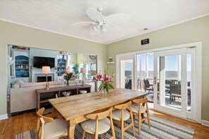 Dining room with direct access to oceanfront screened-in porch