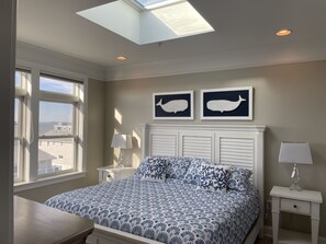 Stylish master bedroom with skylight and ensuite master bathroom 