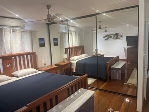 Main bedroom, king bed and large room with television