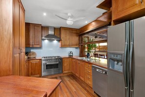Rosewood Kitchen, conventional oven and Everything you need to make a good meal.