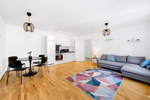 Overview from the living room and the kitchen with the dining table