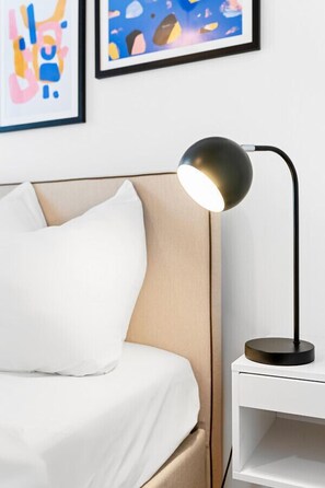 Designer lamp as a small detail in the bedroom to bring the colorful design into a homy feeling