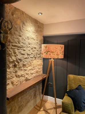 Sitting room - lamp / stone wall detail