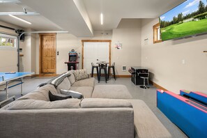 Crooked Pine: - Heated garage game room with ping-pong, skee-ball, shuffleboard, TV lounge, and 2 video arcade games.