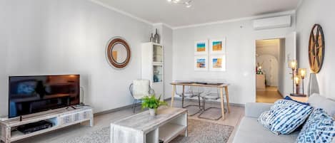 This unique and bright living room equipped with cable TV and A/C will be a perfect place to enjoy the company of your friends #airbnb #airbnbalgarve #portugal #vacations