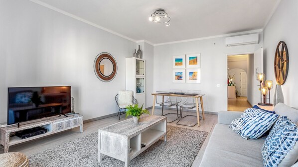 This unique and bright living room equipped with cable TV and A/C will be a perfect place to enjoy the company of your friends #airbnb #airbnbalgarve #portugal #vacations