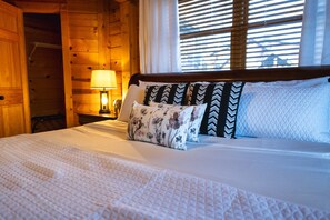 En-suite Master Bedroom on the main level with a closet, smart TV and king bed