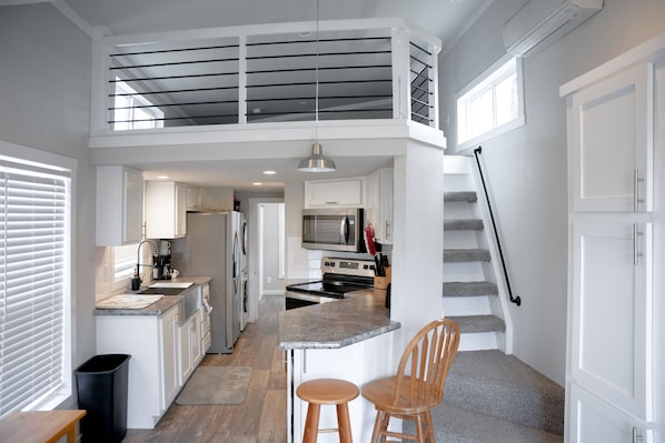 Modern, compact home with fully-equipped kitchen, cozy loft & stylish design.