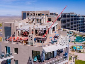 HUGE patio w/ GREAT views, tons of seating, a BBQ, a bar, a hammock & corn hole!