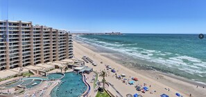 View from patio to the pools, amenities & swim up bar/restaurant!