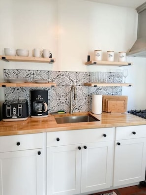 Kitchen is equipped with the essentials to make your stay easy.
