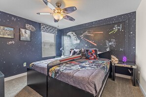 Star Wars room with an X-wing bed (two twin beds).