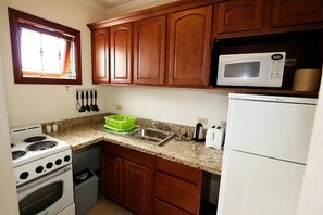 Unit with fully equipped kitchen