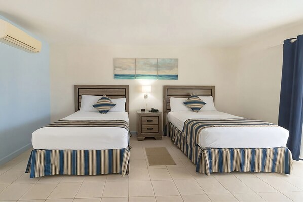 Unit with 2 single beds.  Exact unit will be assigned upon arrival. Views, colors and decor may vary.