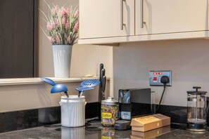 Fully Equipped Kitchen with cooking essentials, silverware, plates, pots, Nespresso Machine, Oven, Fridge-Freezer, Dishwasher and Washing Machine and Dryer. 