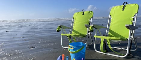 Head to the beach, we have chairs and toys!