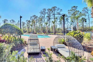 Outdoor swimming pool and sun loungers 