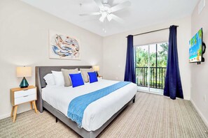 King bedroom with en-suite bathroom and patio access