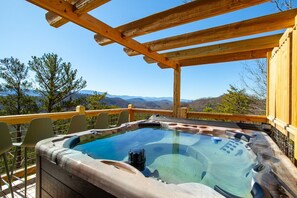 Unwind in this luxurious hot tub while taking in breathtaking mountain views. The pergola overhead adds both charm and a touch of shade for ultimate relaxation.