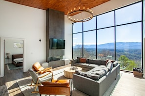 Wake up to panoramic mountain views from every corner of this sleek and spacious home. The vaulted ceilings and natural wood touches create a perfect blend of modern and rustic charm.