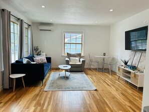 Spacious living room with TV
