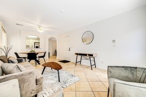 Living/Dining Room displays contemporary décor with a hint of mid-century style