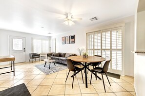 Living/Dining Room displays contemporary décor with a hint of mid-century style