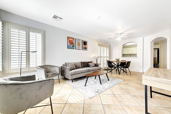 Living/Dining Room displays contemporary décor with a hint of mid-century style