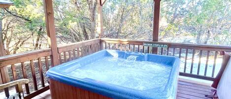 The private hot tub on the back deck is the perfect spot to relax and unwind.